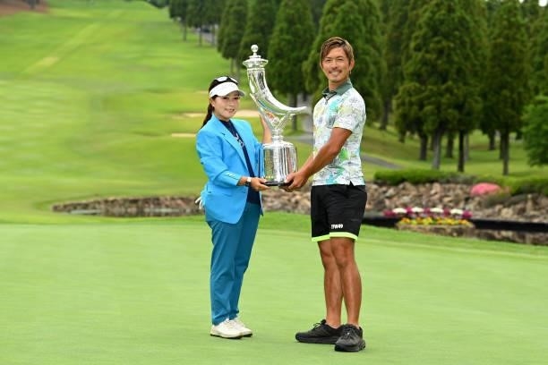 Serena Aoki of Japan poses with her caddie Shota Onishi after winning the tournament following the final round of the Ai Miyazato Suntory Ladies Open...