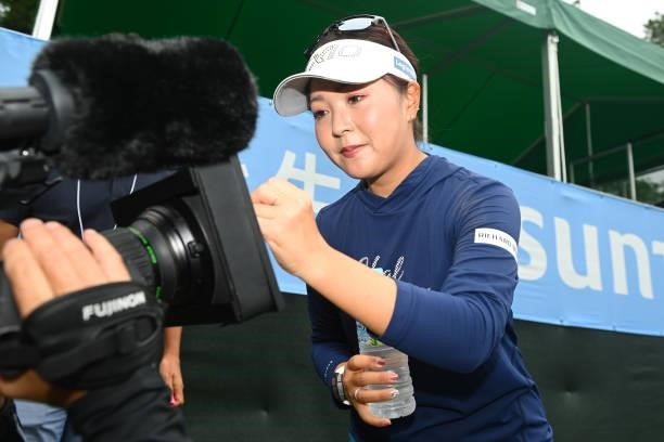 Winner Serena Aoki of Japan signs autographs for the television interview following the final round of the Ai Miyazato Suntory Ladies Open at Rokko...