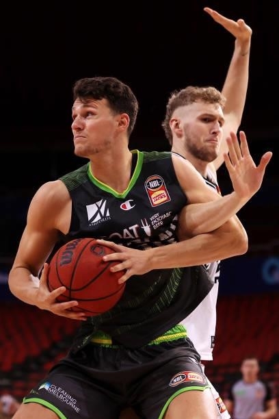 Yanni Wetzall of the Phoenix and Jock Landale of Melbourne United compete for the ball during game two of the NBL Semi-Final Series between the South...