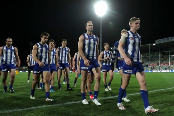 The Kangaroos look dejected after the game ended in a draw during the round 13 AFL match between the North Melbourne Kangaroos and the Greater...