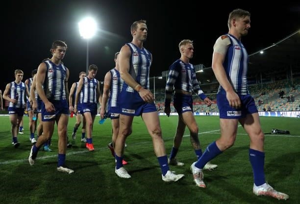 The Kangaroos look dejected after the game ended in a draw during the round 13 AFL match between the North Melbourne Kangaroos and the Greater...