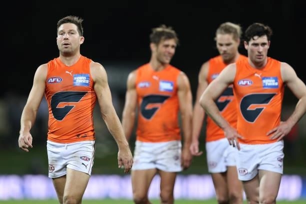 Toby Greene and his Giants team mates look dejected after the game ended in a draw during the round 13 AFL match between the North Melbourne...