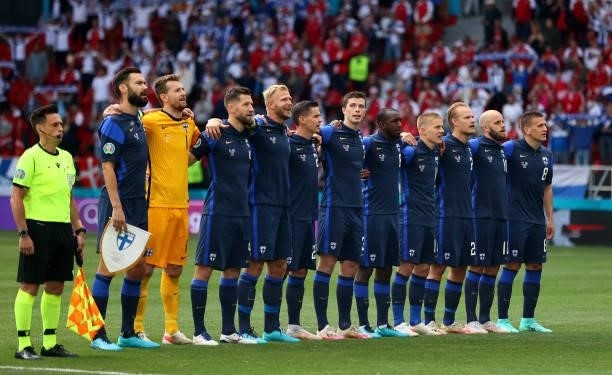 The team of Finland line up during the UEFA Euro 2020 Championship Group B match between Denmark and Finland on June 12, 2021 in Copenhagen, Denmark.