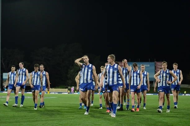 Jack Ziebell of the Kangaroos leads the team off the field after the game during the round 13 AFL match between the North Melbourne Kangaroos and the...
