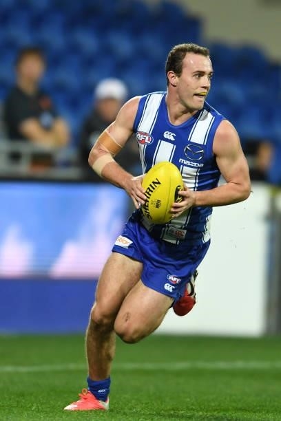 Jack Mahony of the Kangaroos runs the ball during the round 13 AFL match between the North Melbourne Kangaroos and the Greater Western Sydney Giants...