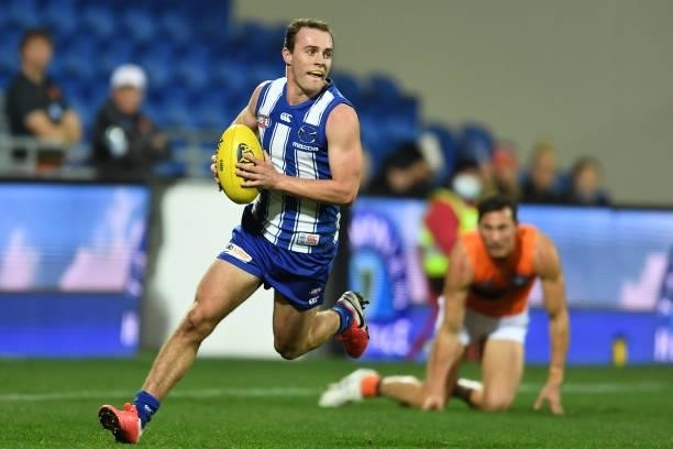 Jack Mahony of the Kangaroos runs the ball during the round 13 AFL match between the North Melbourne Kangaroos and the Greater Western Sydney Giants...