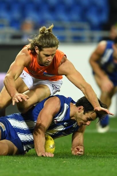 Callan Ward of the Giants makes a tackle during the round 13 AFL match between the North Melbourne Kangaroos and the Greater Western Sydney Giants at...