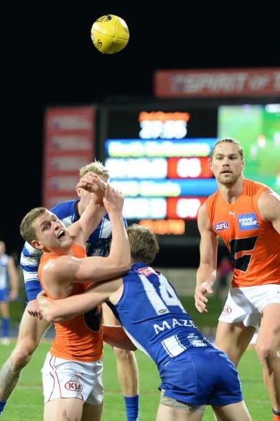 Tom Green of the Giants handballs during the round 13 AFL match between the North Melbourne Kangaroos and the Greater Western Sydney Giants at...