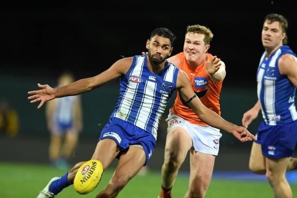 Tarryn Thomas of the Kangaroos kicks the ball during the round 13 AFL match between the North Melbourne Kangaroos and the Greater Western Sydney...