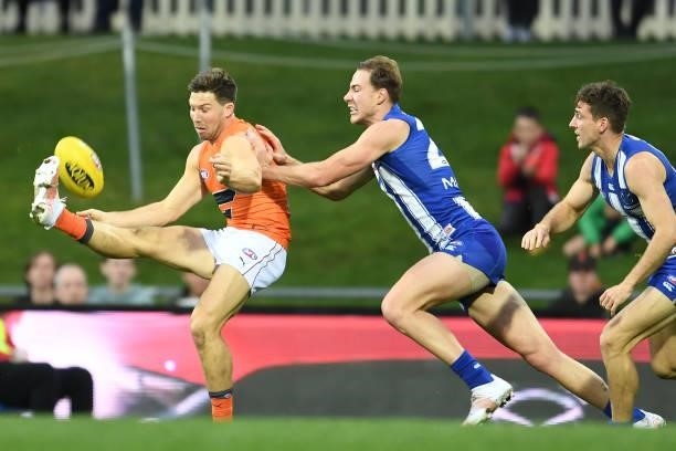 Toby Greene of the Giants kicks the ball during the round 13 AFL match between the North Melbourne Kangaroos and the Greater Western Sydney Giants at...