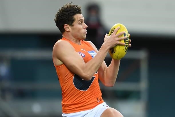 Josh Kelly of the Giants takes a mark during the round 13 AFL match between the North Melbourne Kangaroos and the Greater Western Sydney Giants at...