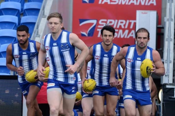 Jack Ziebell of the Kangaroos leads out the team during the round 13 AFL match between the North Melbourne Kangaroos and the Greater Western Sydney...