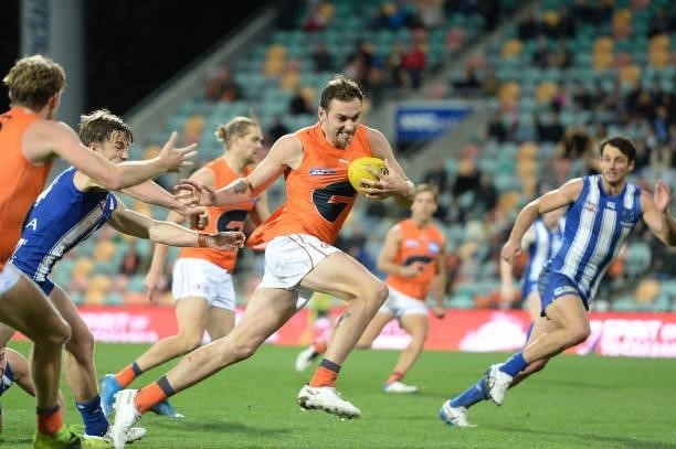 Jeremy Finlayson of the Giants runs the ball during the round 13 AFL match between the North Melbourne Kangaroos and the Greater Western Sydney...