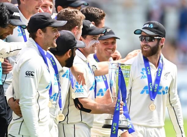 Tom Latham of New Zealand lifts the trophy surrounded by their team mates following Day Four of the Second Test LV= Insurance Test Series match...