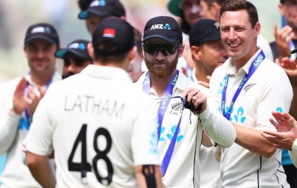 Kane Williamson of New Zealand presents a medal to team mate Tom Latham during Day Four of the Second Test LV= Insurance Test Series match between...