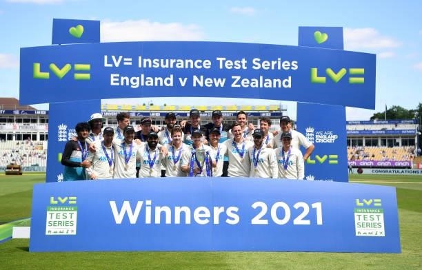 Tom Latham of New Zealand lifts the trophy surrounded by their team mates following Day Four of the Second Test LV= Insurance Test Series match...