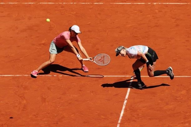 Bethanie Mattek-Sands of The United States, pplayng partner of Iga Swiatek of Poland stretches to play a forehand in their Women's Doubles Final...