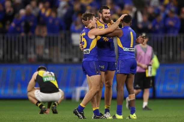 Jamie Cripps, Josh J. Kennedy and Liam Ryan of the Eagles celebrate winning the round 14 AFL match between the West Coast Eagles and the Richmond...