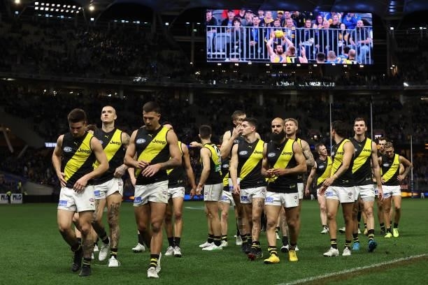 The Tigers walk from the field after being defeated during the round 14 AFL match between the West Coast Eagles and the Richmond Tigers at Optus...
