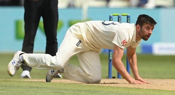 Mark Wood of England falls after bowling during the second LV= Test match against New Zealand at Edgbaston on June 13, 2021 in Birmingham, England.