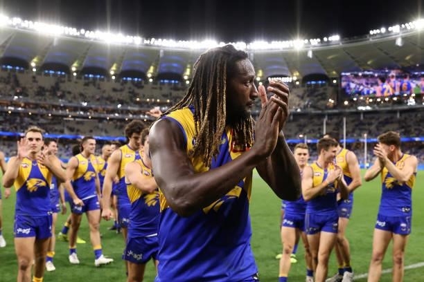 Nic Naitanui of the Eagles leads the team from the field after winning the round 14 AFL match between the West Coast Eagles and the Richmond Tigers...