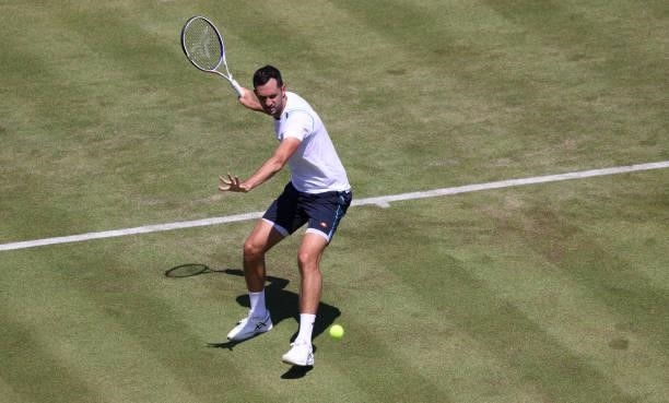 James Ward of Great Britain plays a forehand during his Men's Singles Qualifying match against Illya Marchenko of Ukraine at the cinch Championships...