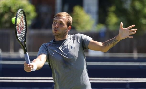 Dan Evans of Great Britain in action on the practice courts during the cinch Championships 2021 at The Queen's Club on June 13, 2021 in London,...