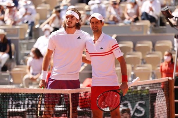 Stefanos Tsitsipas of Greece and Novak Djokovic of Serbia pose for a photo at the net prior to their Men's Singles Final match during Day Fifteen of...