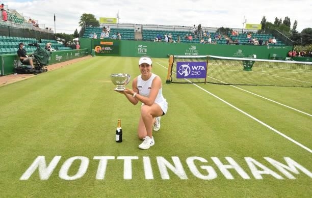 Johanna Konta of Great Britain holds the Viking Open Trophy after she beats Shuai Zhang of China at Nottingham Tennis Centre on June 13, 2021 in...