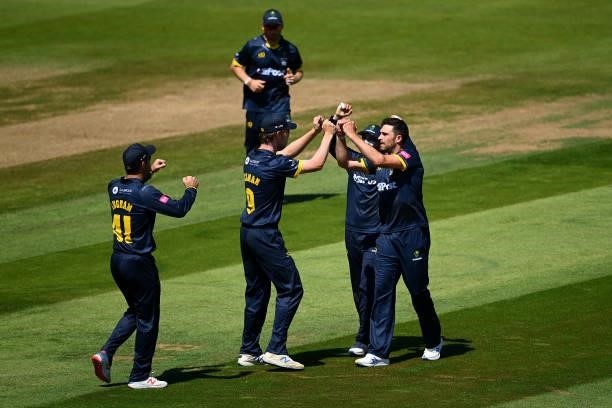 Ruaidhri Smith of Glamorgan celebrates with teammates after taking the wicket of Tom Westley of Essex during the Vitality T20 Blast match between...
