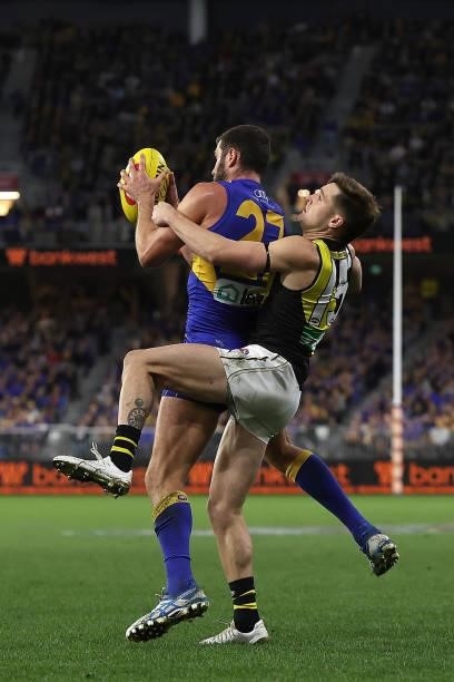 Jack Darling of the Eagles marks the ball against Jayden Short of the Tigers during the round 14 AFL match between the West Coast Eagles and the...