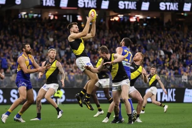 Noah Balta of the Tigers marks the ball during the round 14 AFL match between the West Coast Eagles and the Richmond Tigers at Optus Stadium on June...