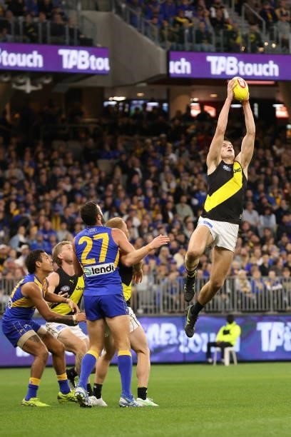 Callum Coleman-Jones of the Tigers marks the ball marks the ball during the round 14 AFL match between the West Coast Eagles and the Richmond Tigers...