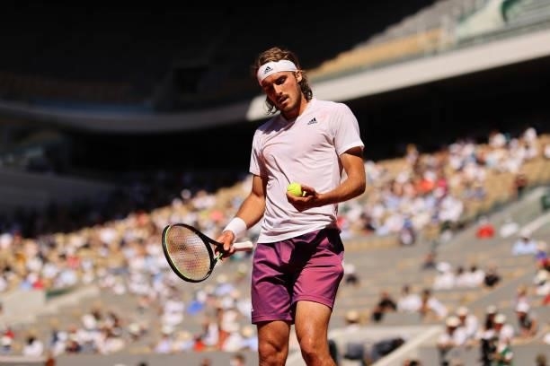 Stefanos Tsitsipas of Greece selects a ball as he prepares to serve in his Men's Singles Final match against Novak Djokovic of Serbia during Day...