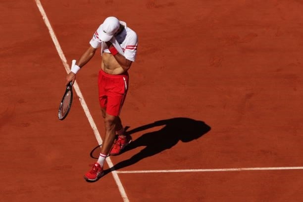 Novak Djokovic of Serbia looks dejected in his Men's Singles Final match against Stefanos Tsitsipas of Greece during Day Fifteen of the 2021 French...