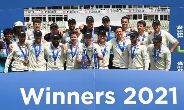 Tom Latham holds the trophy with the New Zealand squad as they celebrate their series victory after winning the second LV= Test match against England...