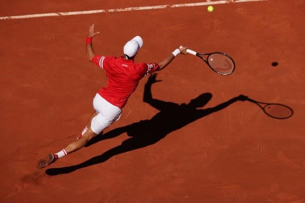 Novak Djokovic of Serbia plays a forehand in his Men's Singles Final match against Stefanos Tsitsipas of Greece during Day Fifteen of the 2021 French...