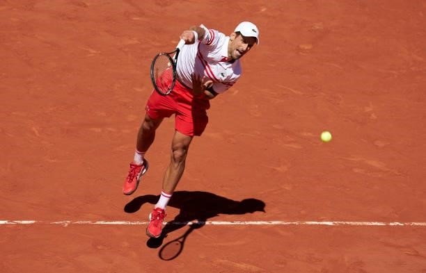 Novak Djokovic of Serbia serves in his Men's Singles Final match against Stefanos Tsitsipas of Greece during day fifteen of the 2021 French Open at...