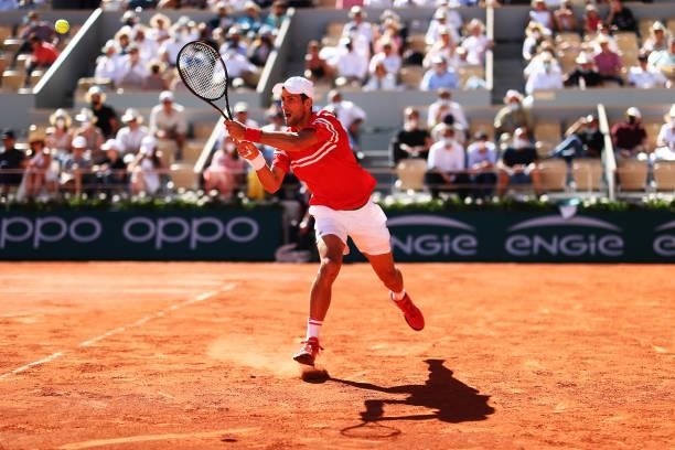 Novak Djokovic of Serbia plays a backhand in his Men's Singles Final match against Stefanos Tsitsipas of Greece during Day Fifteen of the 2021 French...
