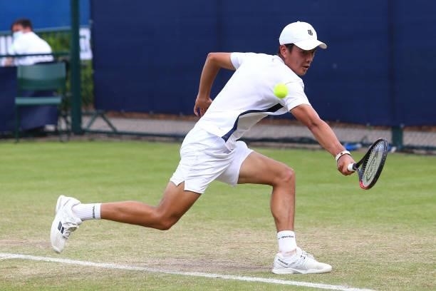 Lui Maxted of Great Britain hits a backhand against Kacper Zuk of Poland during day 1 of the Nottingham Trophy at Nottingham Tennis Centre on June...