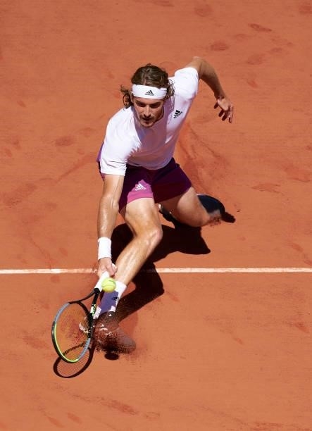 Stefanos Tsitsipas of Greece returns a ball in his Men's Singles Final match against Novak Djokovic of Serbia during day fifteen of the 2021 French...