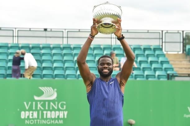 Frances Tafore of United holds the Mens Singles Vikings Open Trophy after he beats Denis Kudla of United States at Nottingham Tennis Centre on June...
