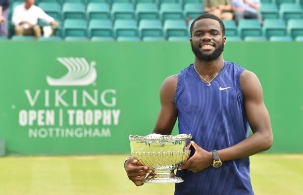 Frances Tafore of United States holds the Mens Singles Vikings Open Trophy after he beats Denis Kudla of United States at Nottingham Tennis Centre on...