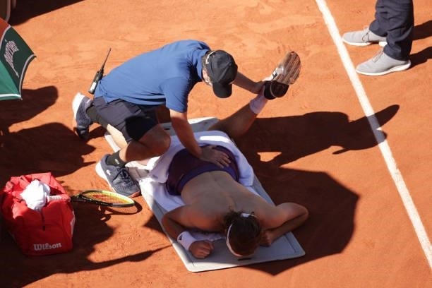 Stefanos Tsitsipas of Greece receives medical treatment on court after the third set in his Men's Singles Final match against Novak Djokovic of...