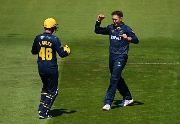 Marnus Labuschagne celebrates taking the wicket of Michael Pepper of Essex with Chris Cooke during the Vitality T20 Blast match between Glamorgan and...