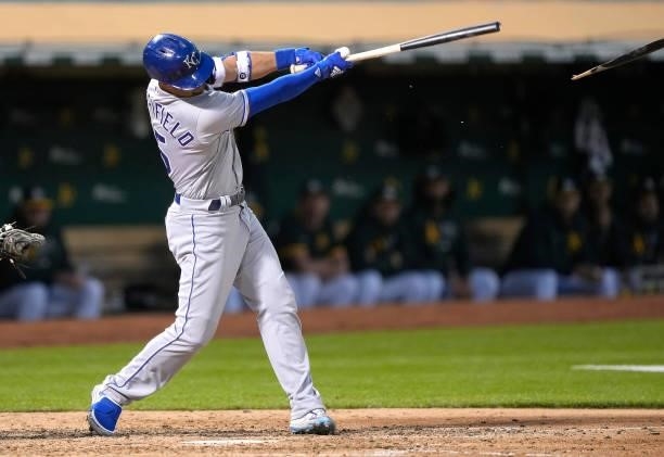 Whit Merrifield of the Kansas City Royals breaking his bat on a line out for the final out against the Oakland Athletics in the top of the seventh...