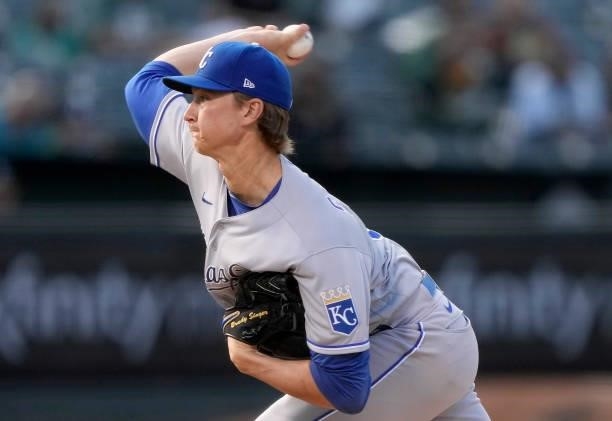 Brady Singer of the Kansas City Royals pitches against the Oakland Athletics in the bottom of the first inning at RingCentral Coliseum on June 11,...