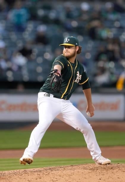 Cole Irvin of the Oakland Athletics pitches against the Kansas City Royals in the top of the seventh inning at RingCentral Coliseum on June 11, 2021...