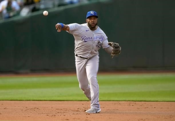 Hanser Alberto of the Kansas City Royals throws to first base throwing out Mark Canha of the Oakland Athletics in the bottom of the first inning at...