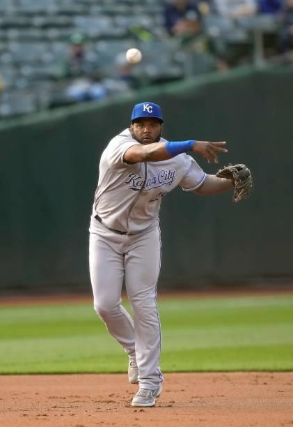 Hanser Alberto of the Kansas City Royals throws to first base throwing out Mark Canha of the Oakland Athletics in the bottom of the first inning at...